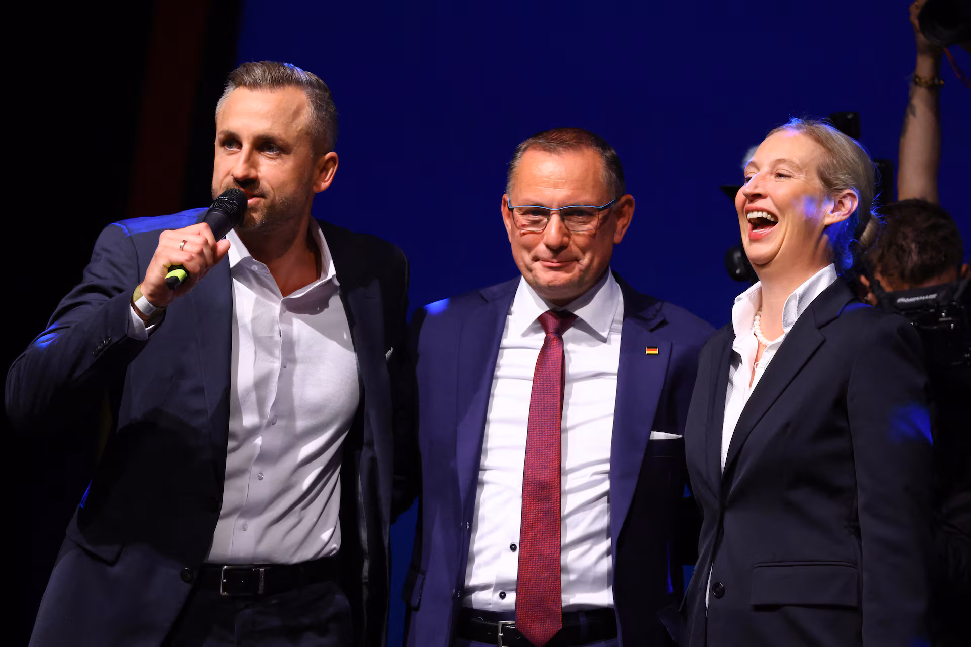 Top candidate of the Alternative for Germany (AfD), Ulrich Siegmund, speaks next to party co-leaders Tino Chrupalla and Alice Weidel at the AfD election party, after exit polls in the Saxony-Anhalt state elections, in Magdeburg, Germany, September 6, 2026.